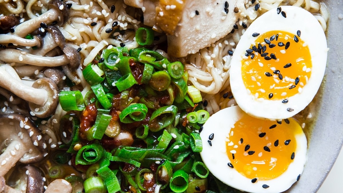 Easy Chicken Ramen Soup in a bowl with egg mushroom green onions