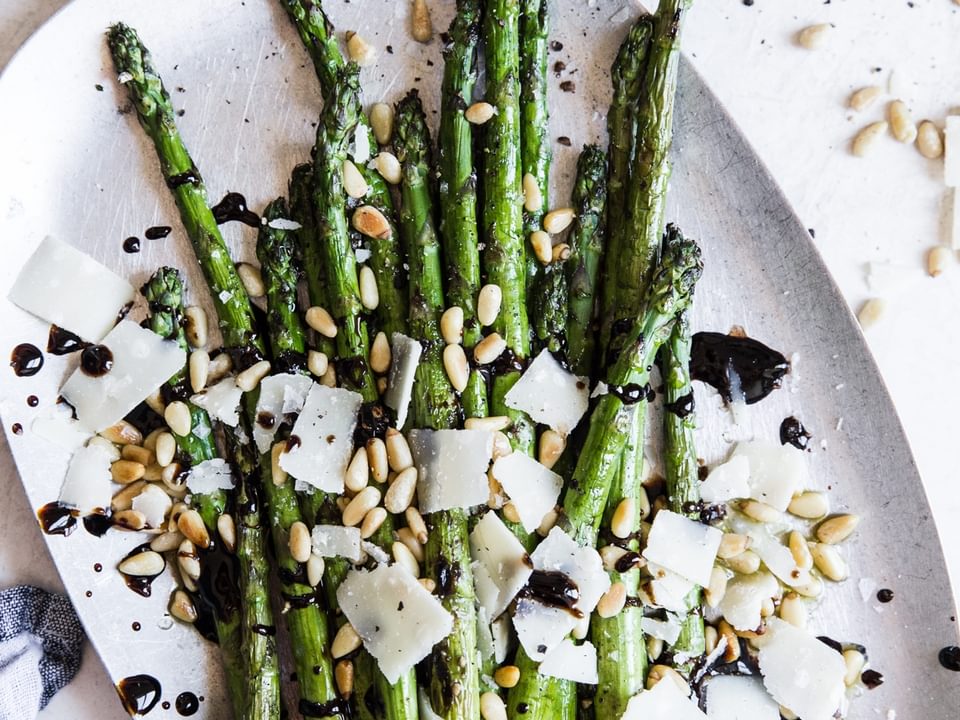 Grilled Asparagus With Balsamic Glaze, pine nuts, and parmesan cheese