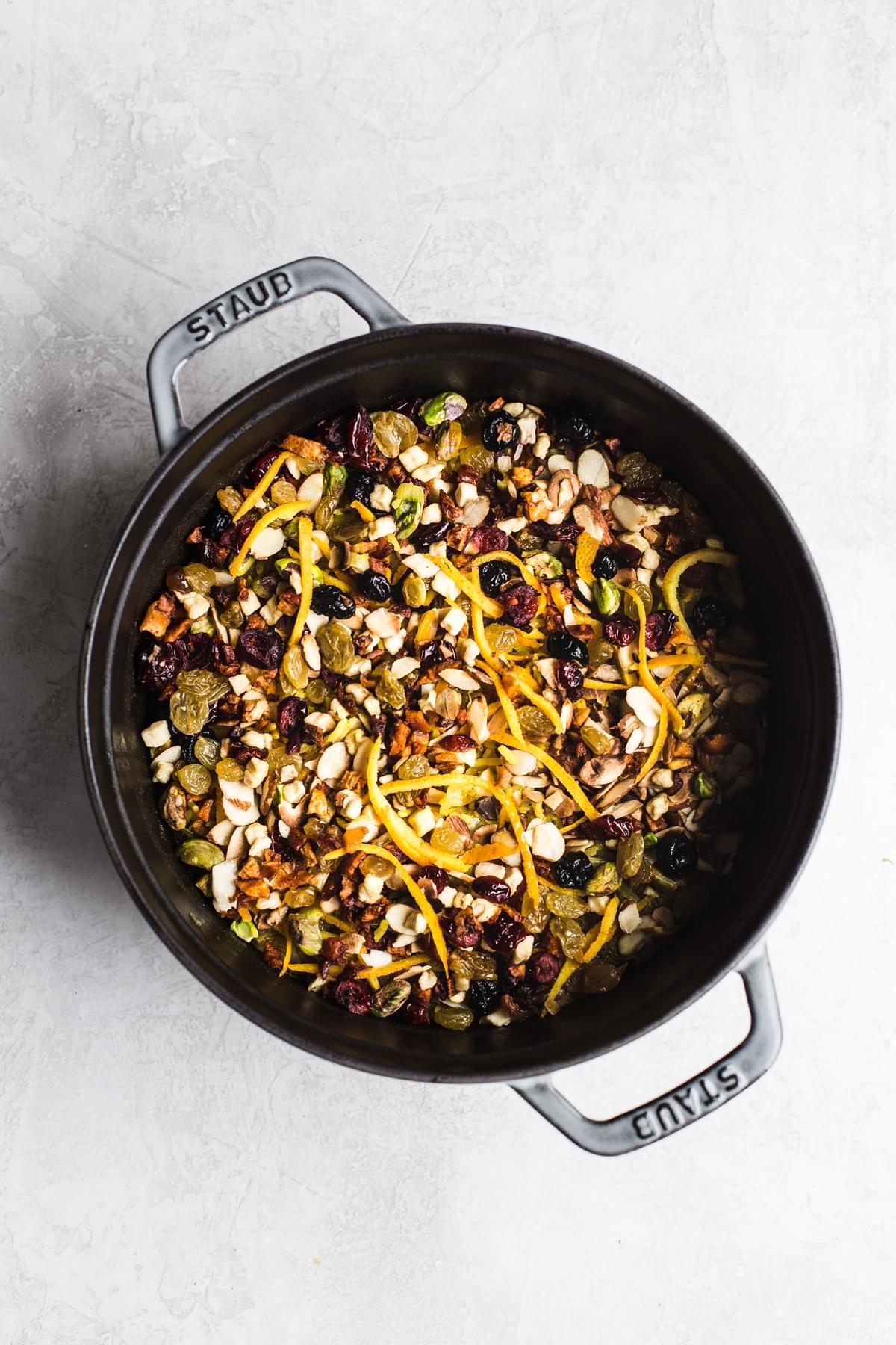 jeweled rice with dried fruit and nuts in a large pot