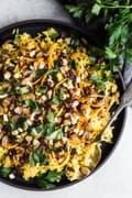 jeweled rice in a bowl yellow rice with nuts and dried fruit and herbs