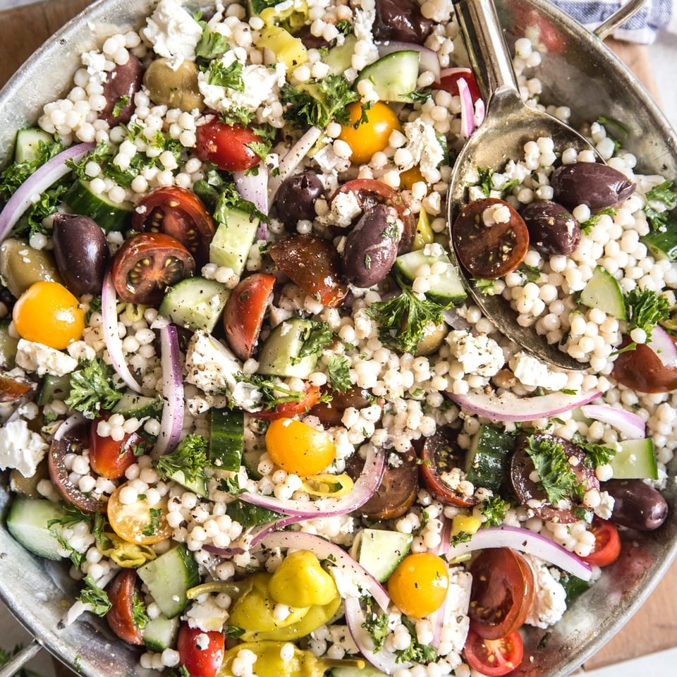 Mediterranean Couscous Salad with tomatoes and onions and cucumbers