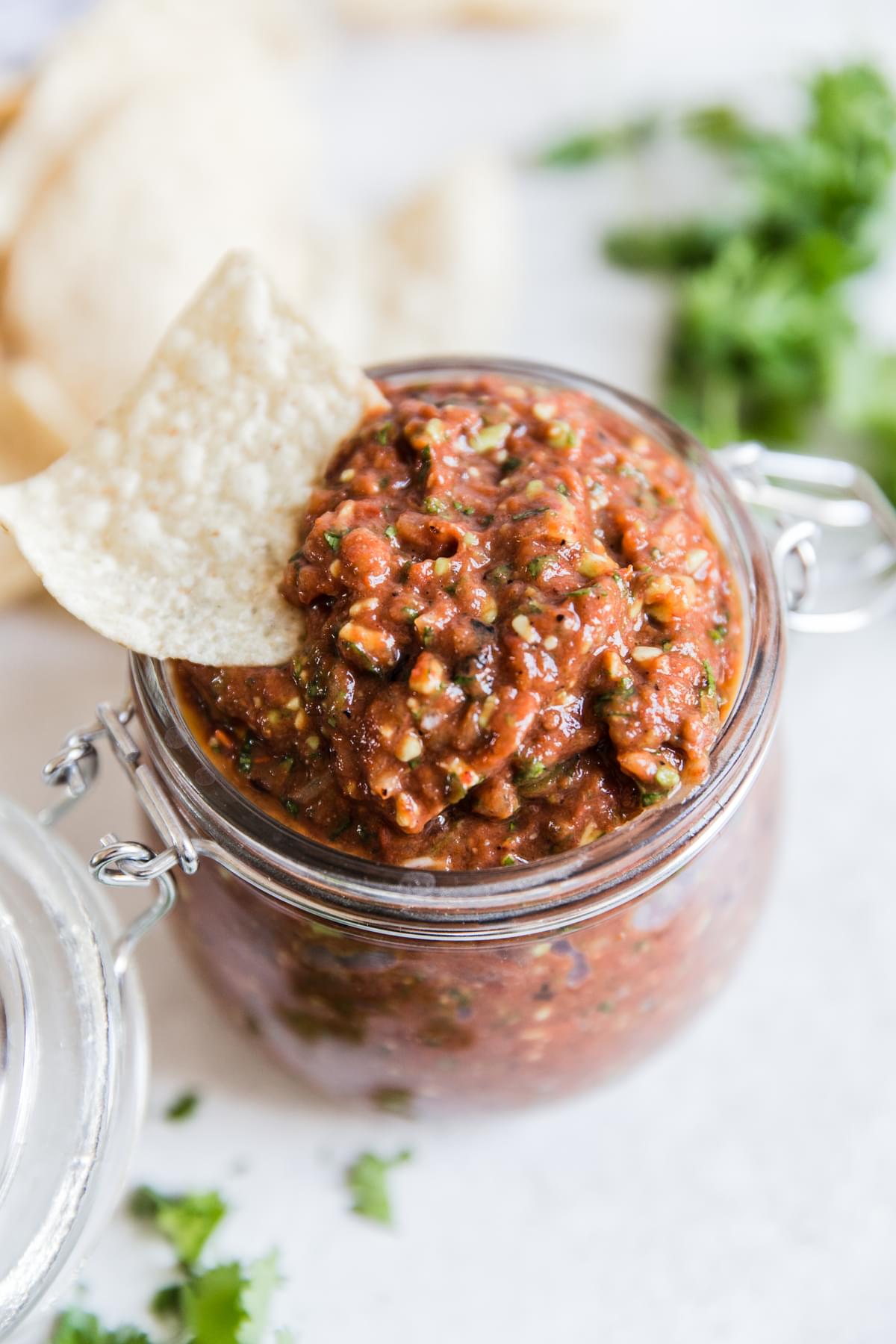a jar of fresh tomato homemade restaurant style salsa