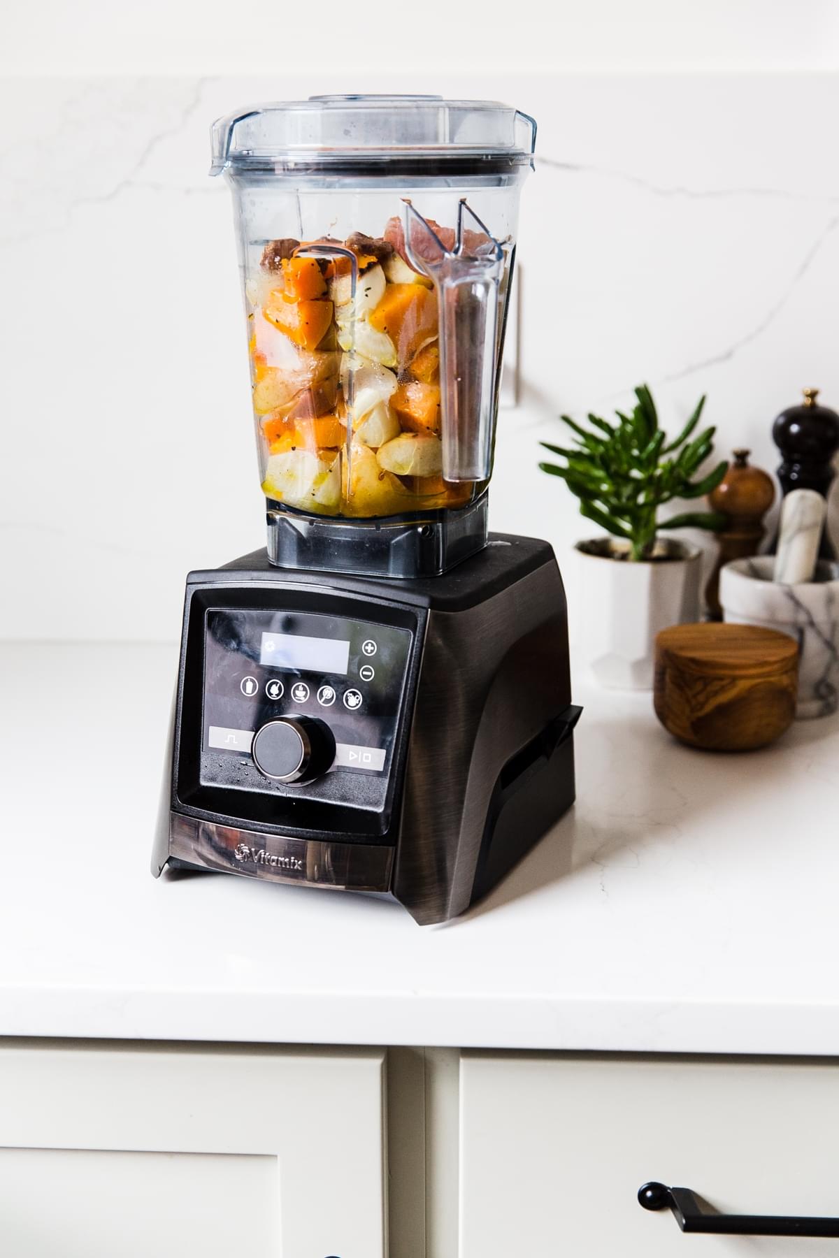 a vitamix blender full of roasted butternut squash and apples for Roasted Butternut Squash Soup With Apples