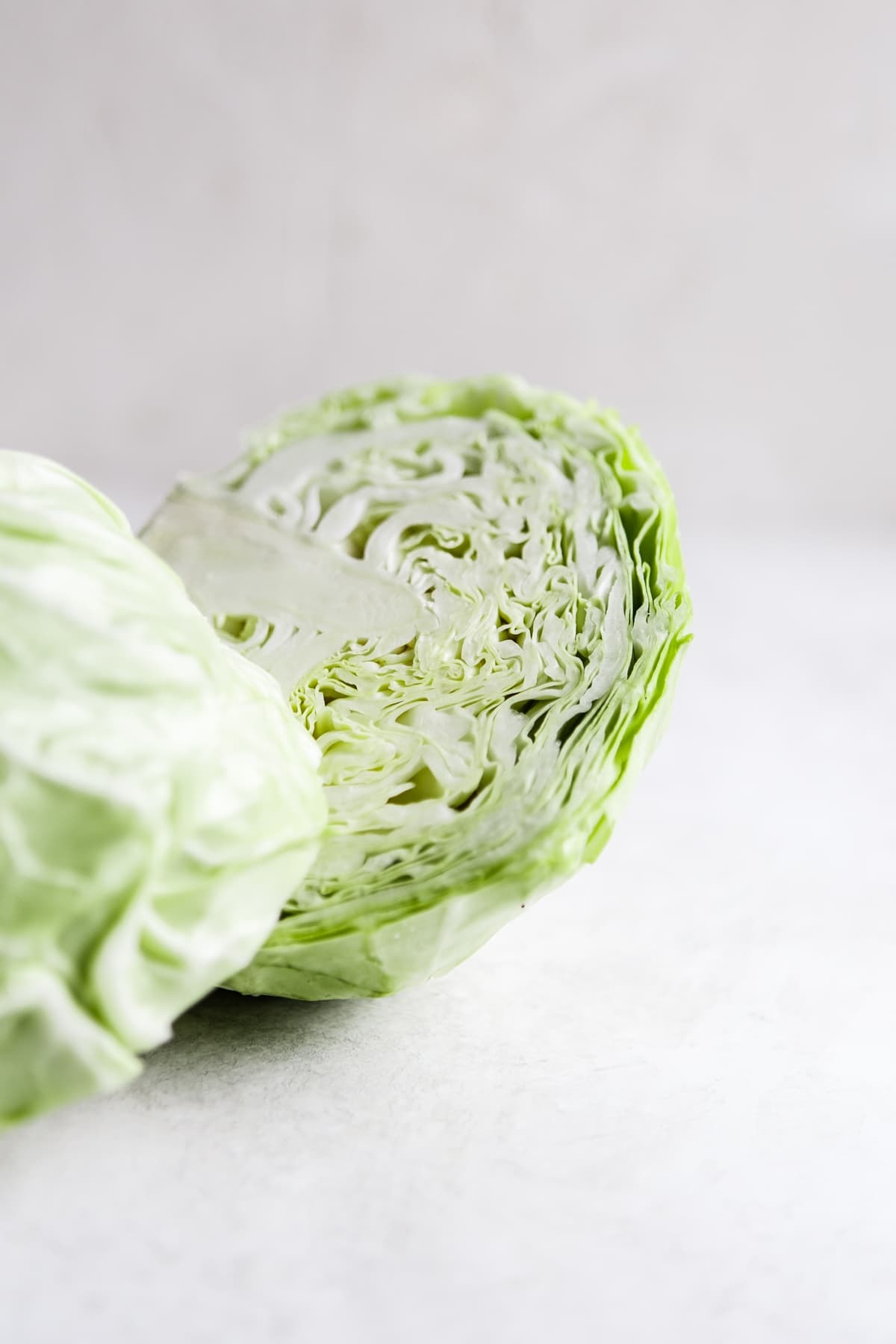 a head of green cabbage sliced in half
