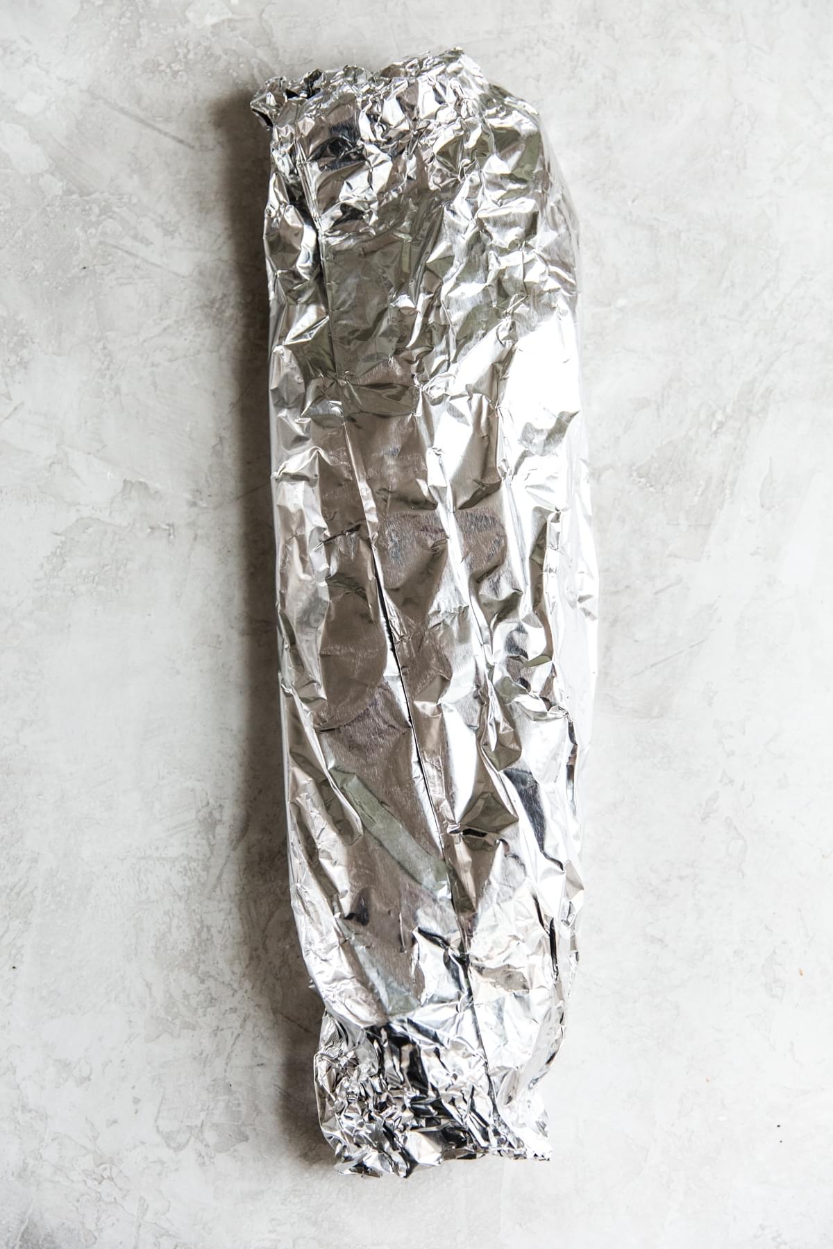 a fillet of salmon wrapped in foil