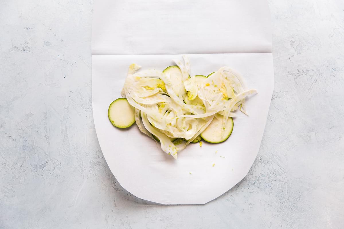 zucchini and fennel on parchment paper for en papillote