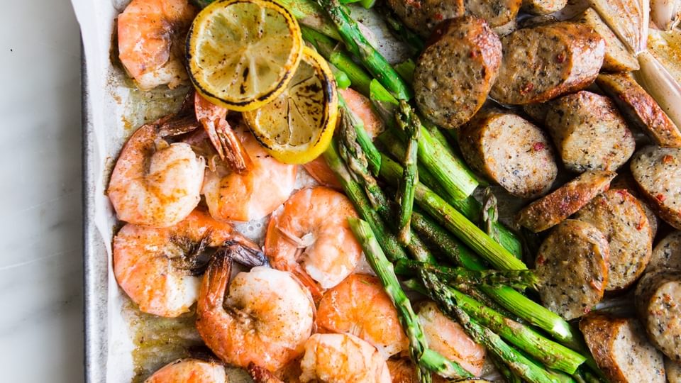Shrimp And Sausage Sheet Pan Dinner with asparagus and lemon