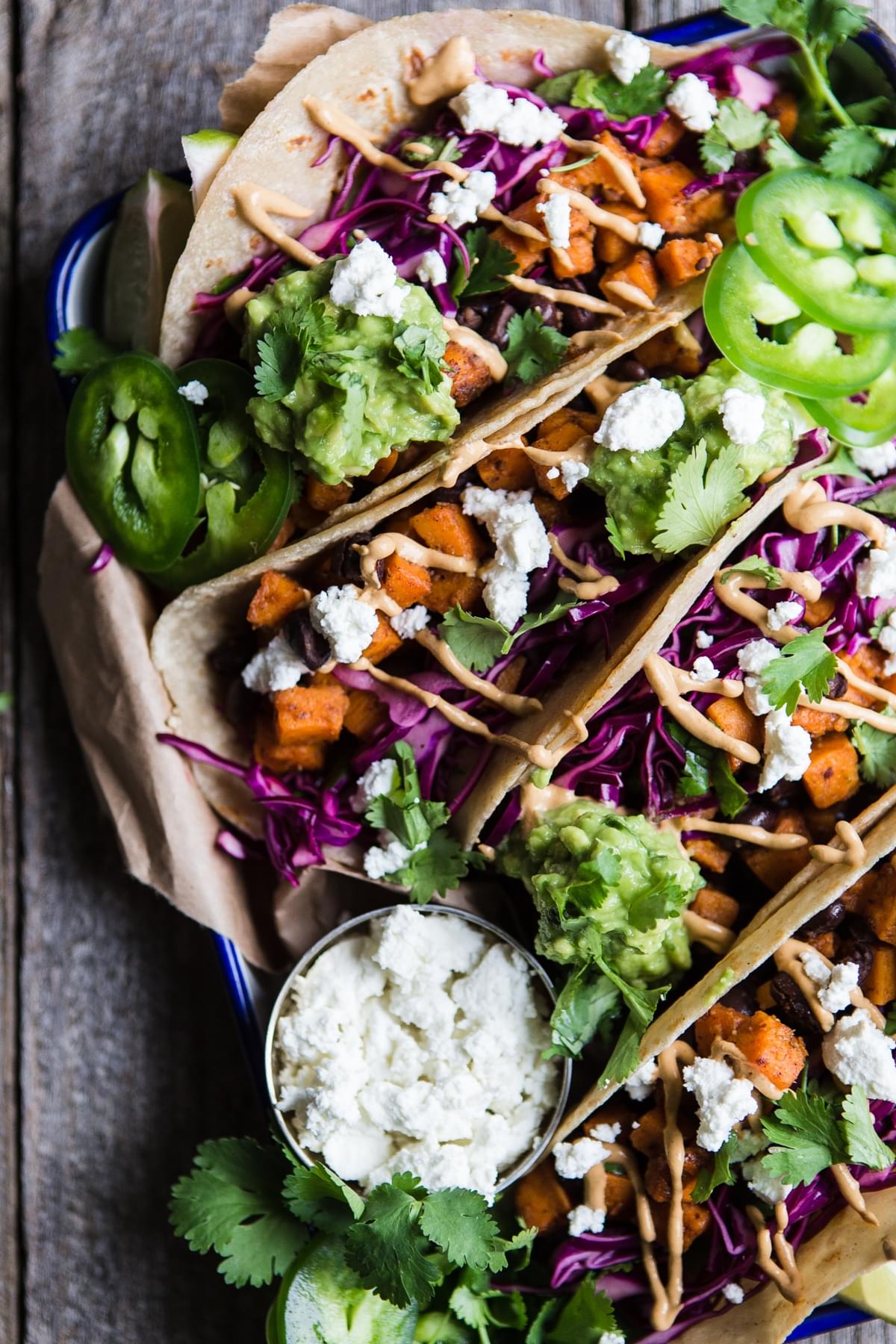 Sweet Potato Tacos with goat cheese, red cabbage, jalapeños