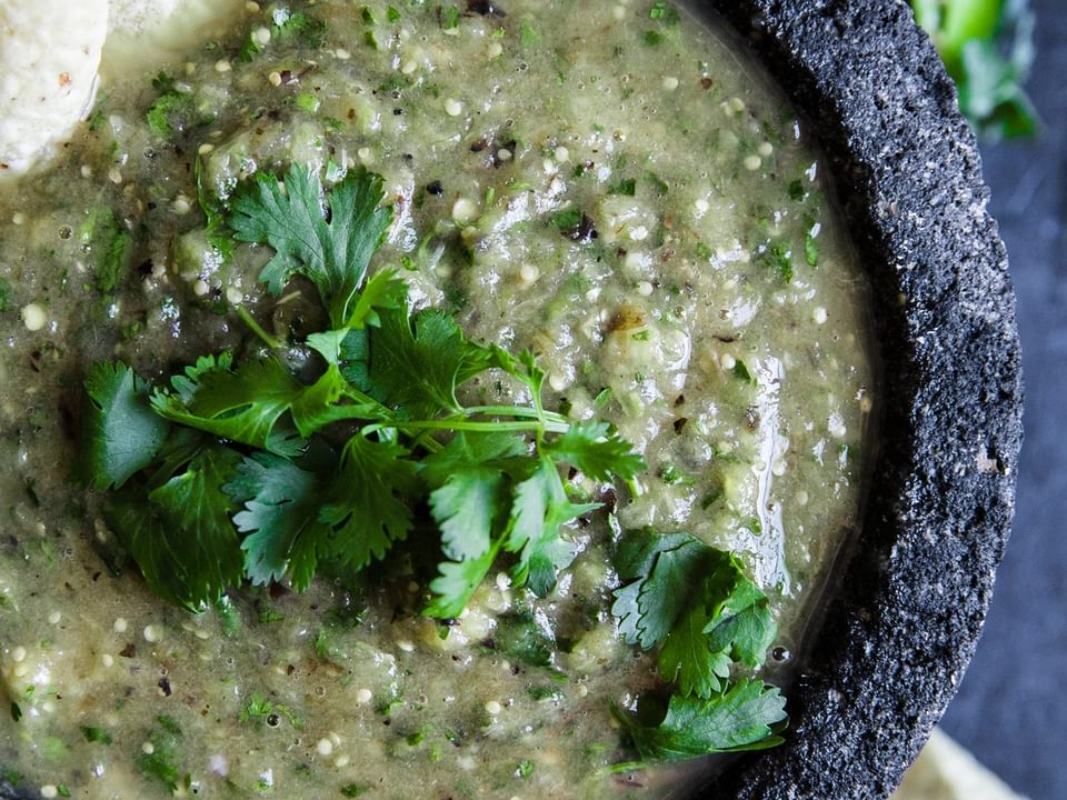 homemade salsa verde made with tomatillos in a bowl