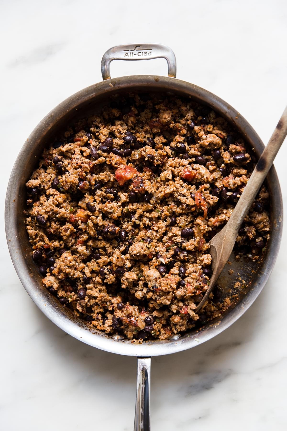 cooked ground turkey with black beans, tomatoes and spices for filling stuffed bell peppers