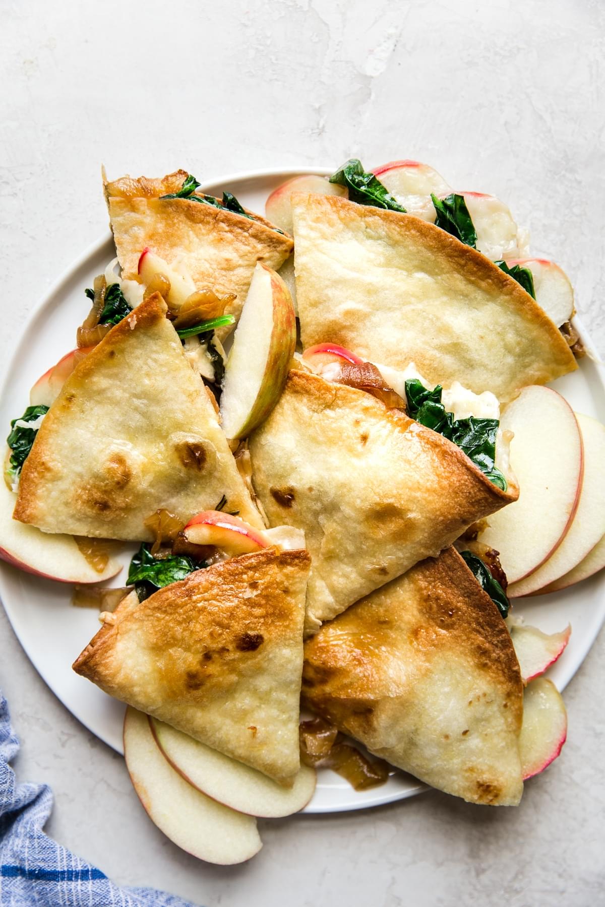 Apple, Caramelized Onion and spinach Baked Quesadillas on a plate