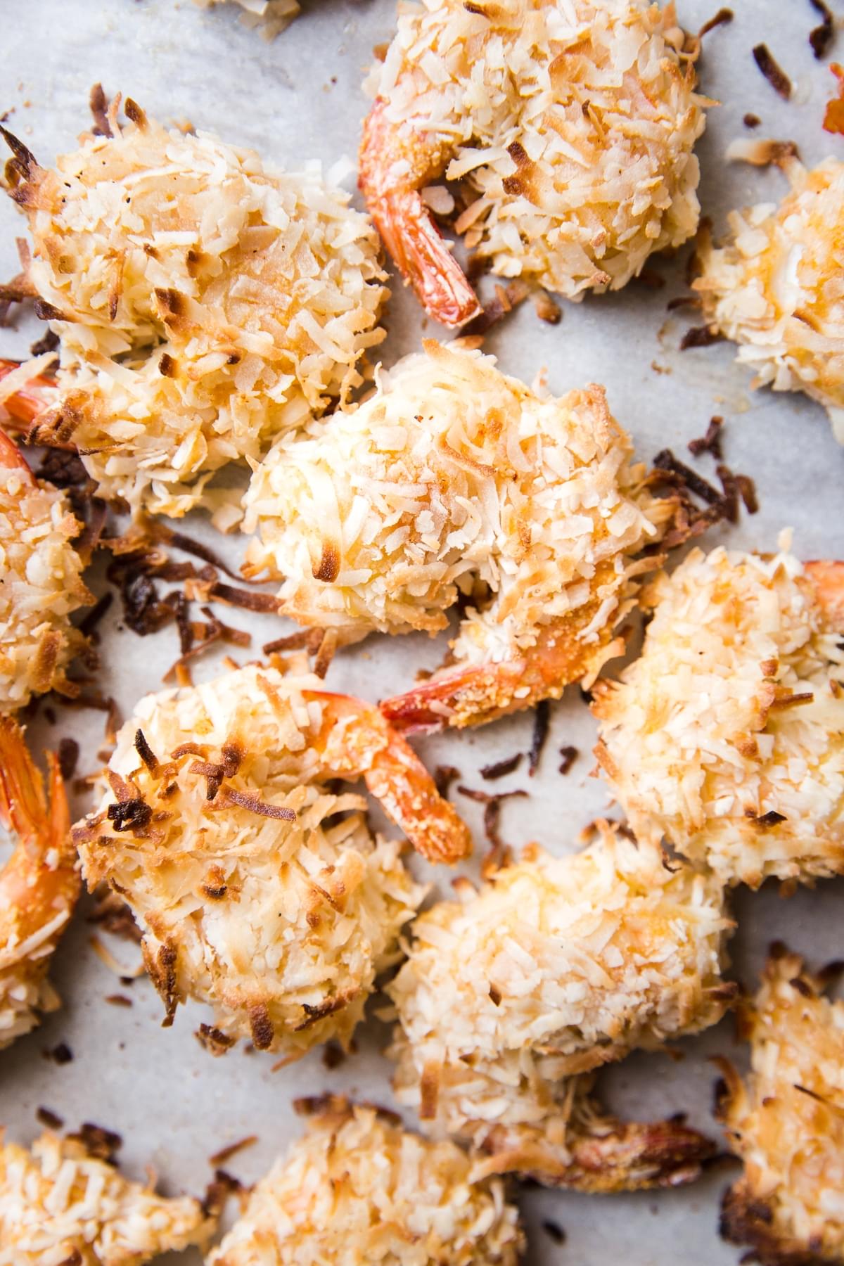 toasted coconut shrimp on parchment paper