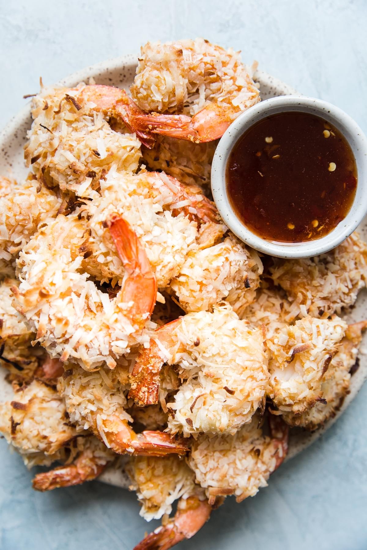 plate of baked coconut shrimp with sweet chili dipping sauce