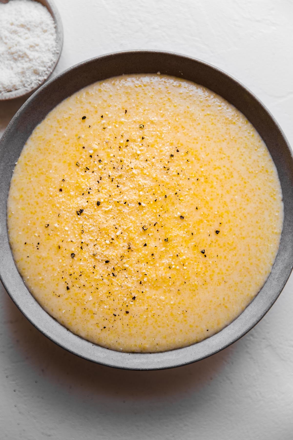 A bowl of creamy parmesan polenta in a bowl