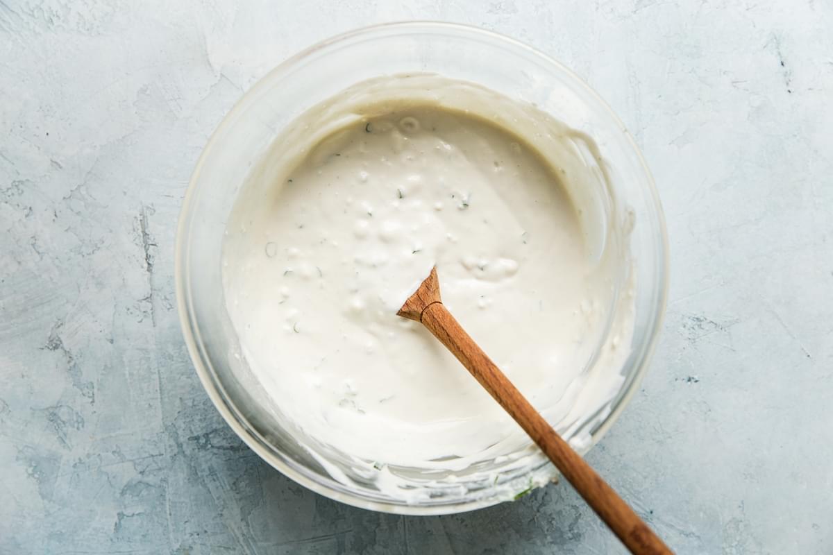 homemade blue cheese dressing in a bowl with a spoon