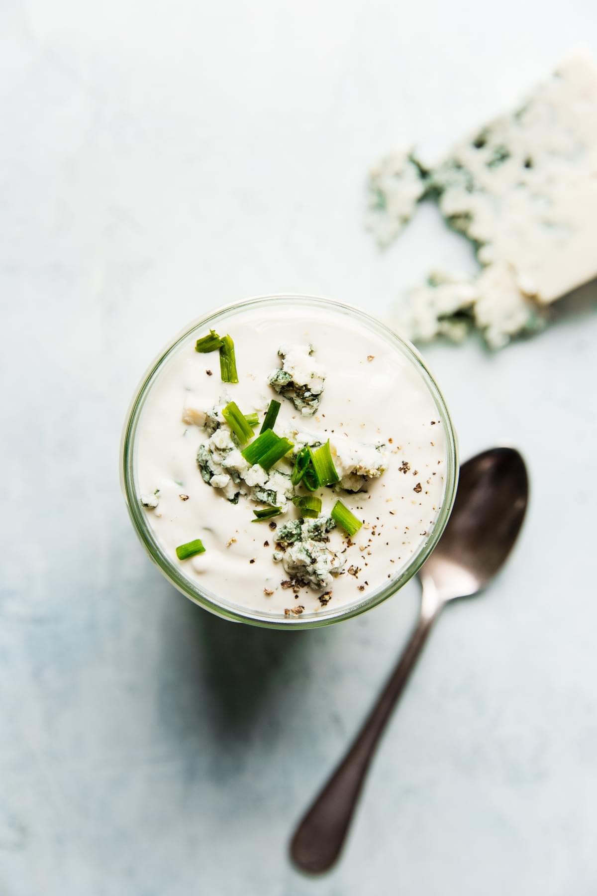 homemade blue cheese dressing in a jar with a spoon