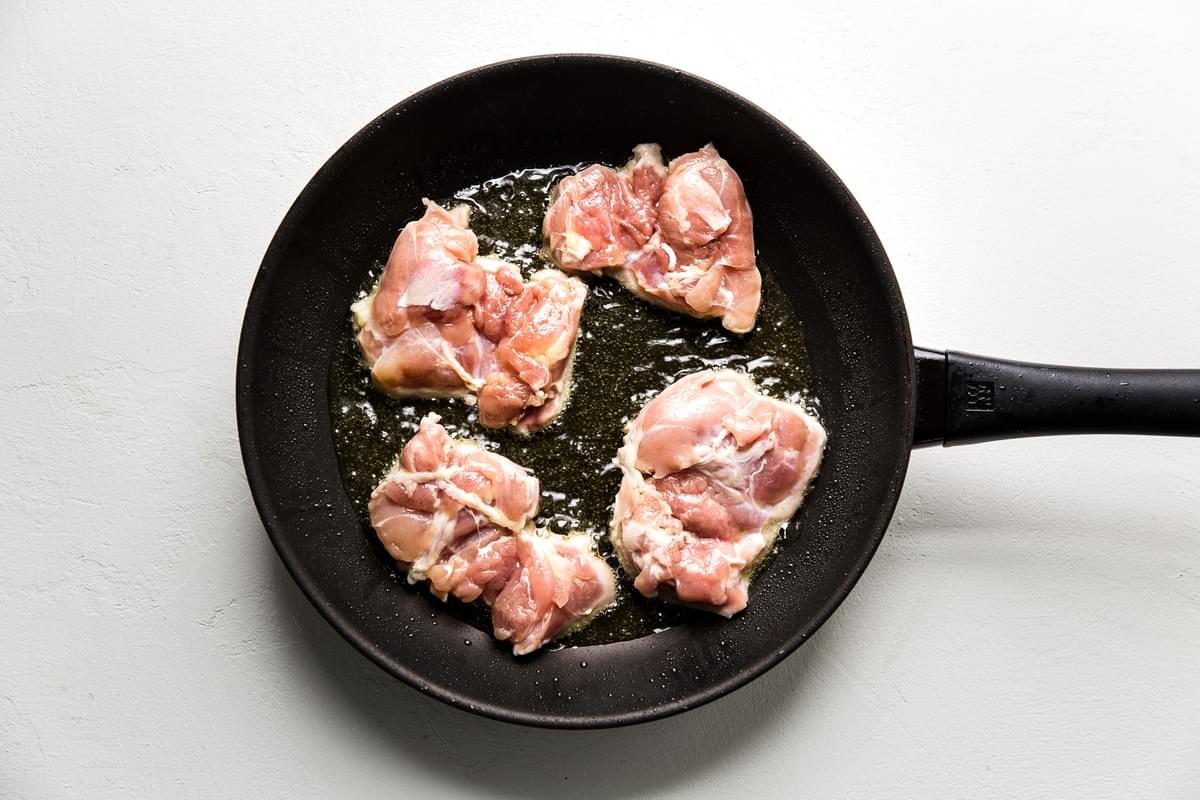 Boneless Skinless Chicken Thighs in a frying pan