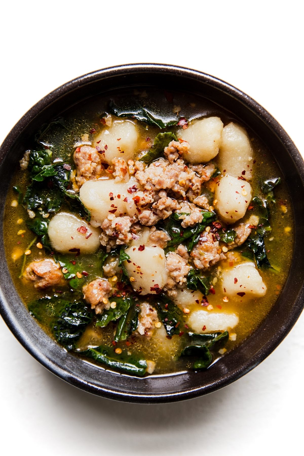 ceramic bowl of cauliflower gnocchi zuppa toscana