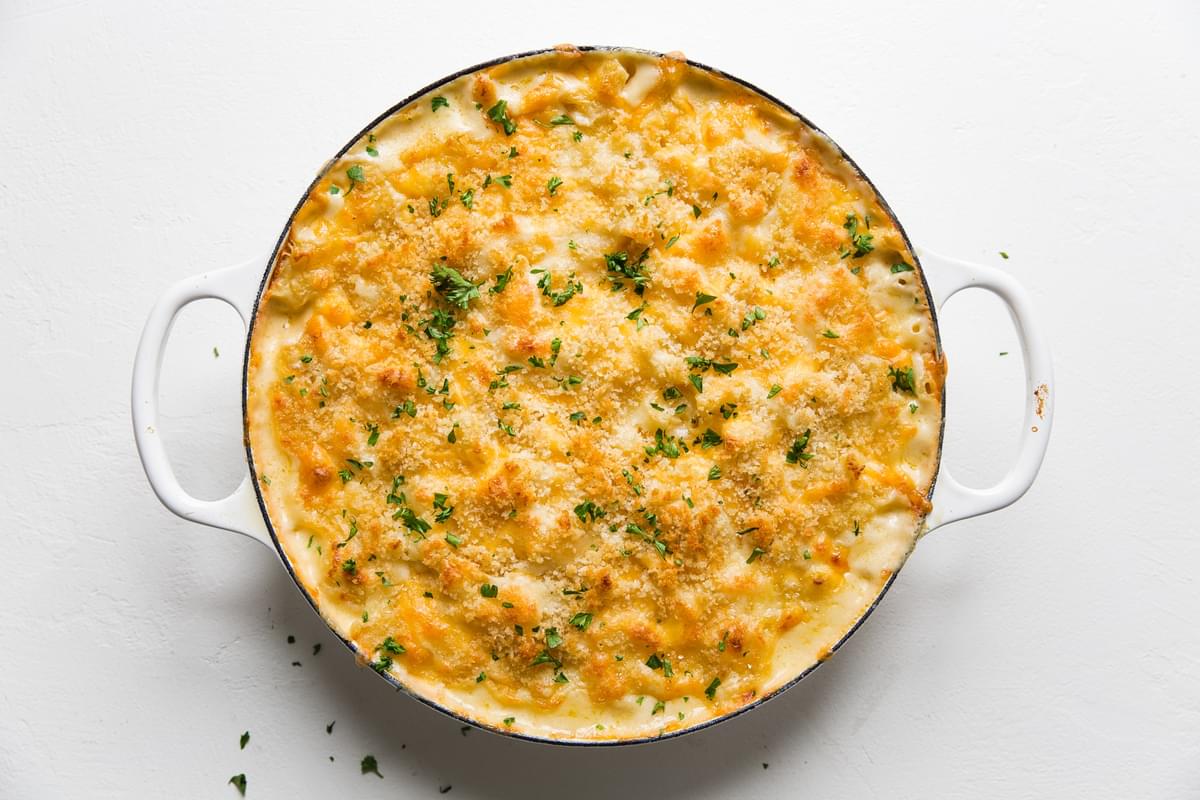 Classic Baked Macaroni And Cheese fresh from the oven in a white dish