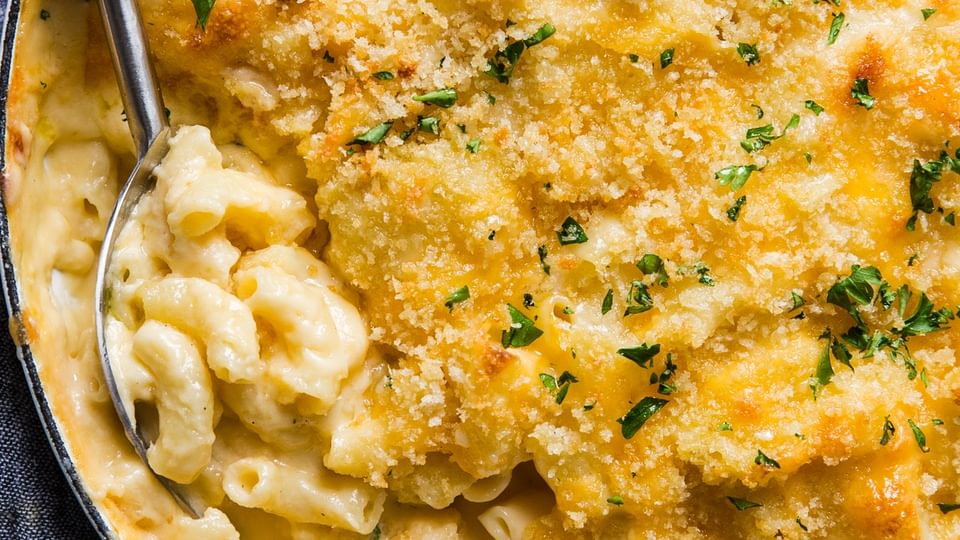 Baked Macaroni And Cheese with panko crust and serving spoon