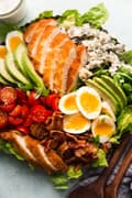 close up of classic cobb salad with crispy panko chicken and buttermilk ranch dressing