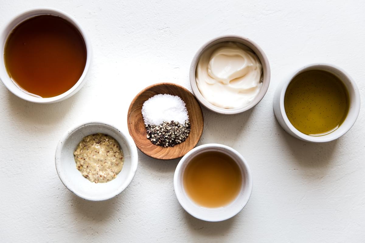 ingredients for creamy maple dressing in small bowls