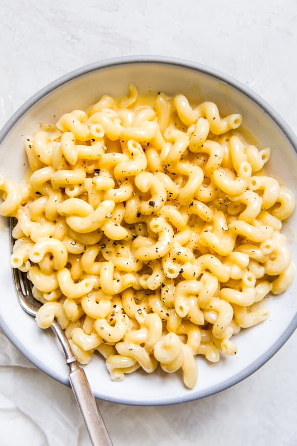 Four ingredient stovetop mac and cheese topped with black pepper in a bowl