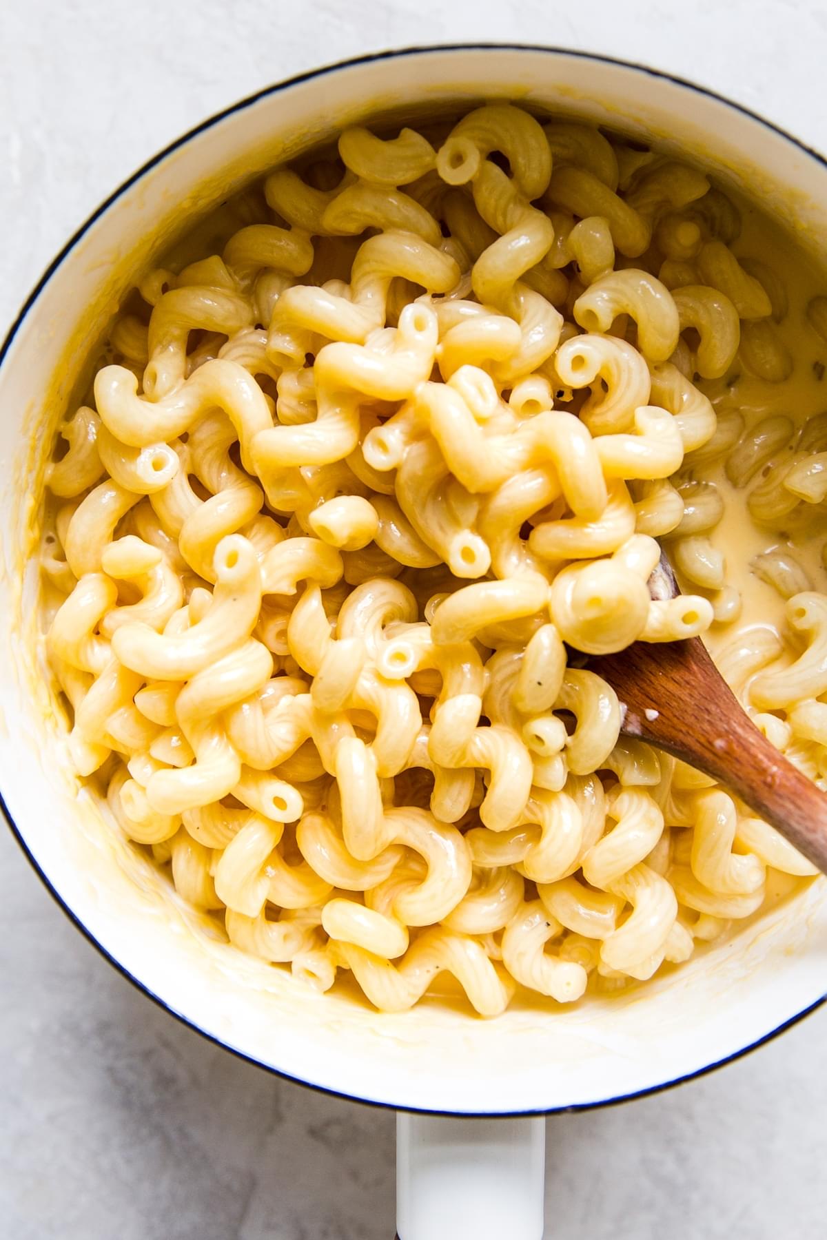 white enamel pot filled with stovetop mac and cheese