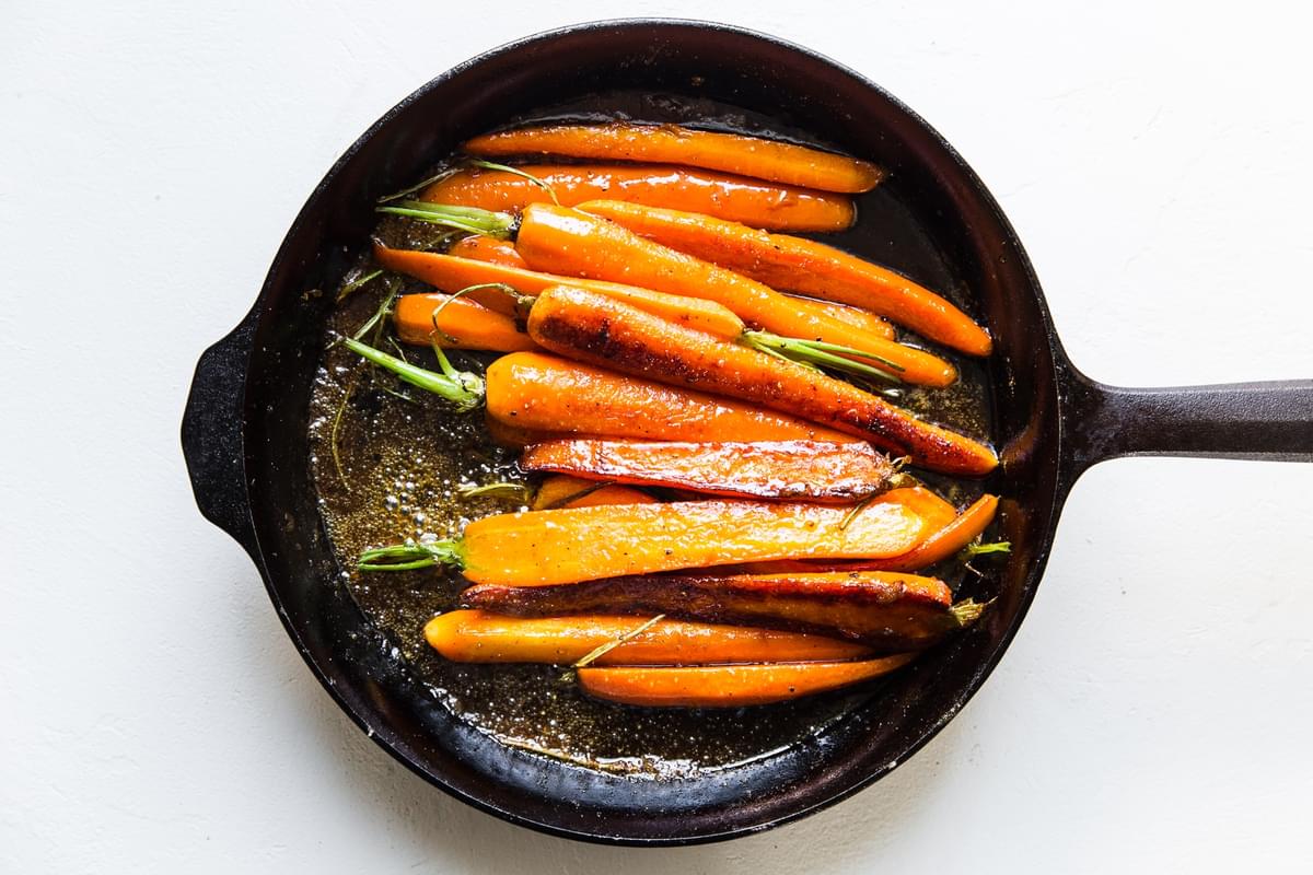 easy glazed carrots in a cast iron skillet