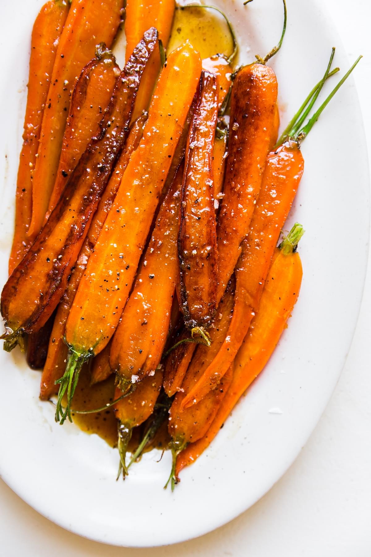 easy glazed carrots on a white serving platter