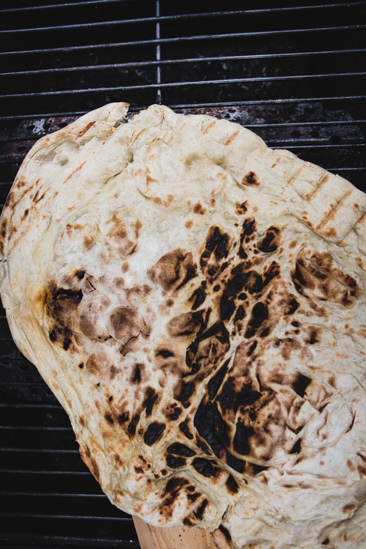 piece of grilled pizza dough