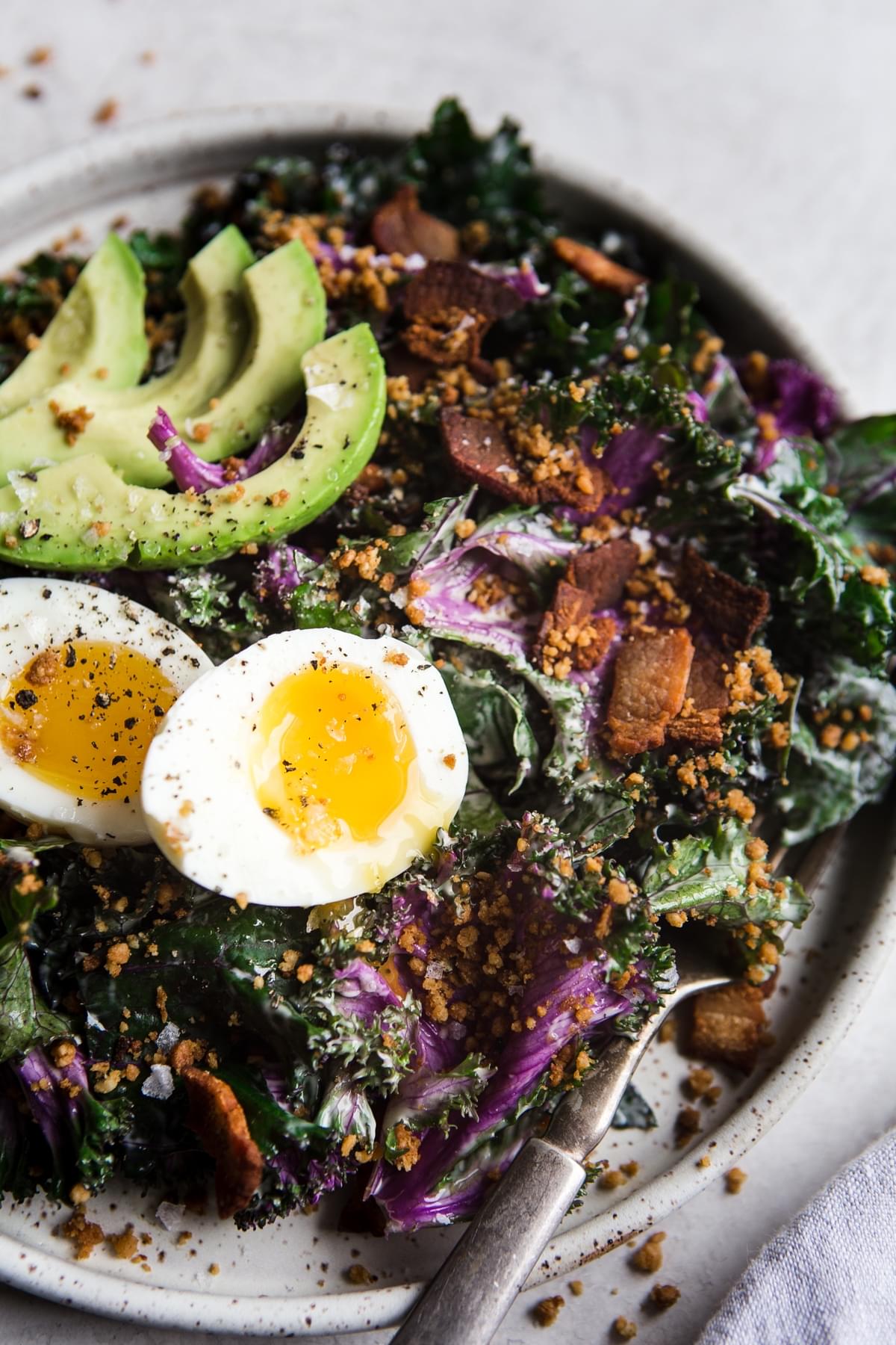 Whole30 approved Kale caesar salad with soft boiled eggs