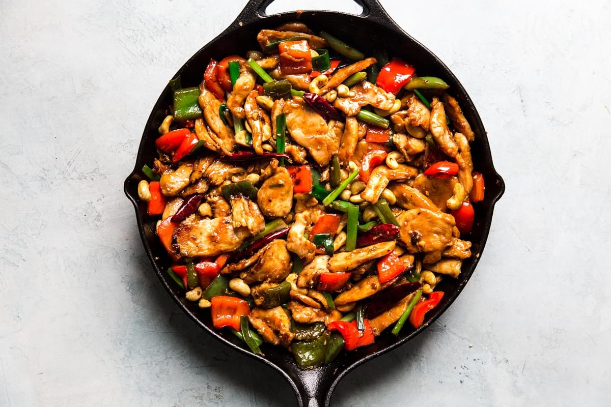kung pao chicken in a cast iron skillet