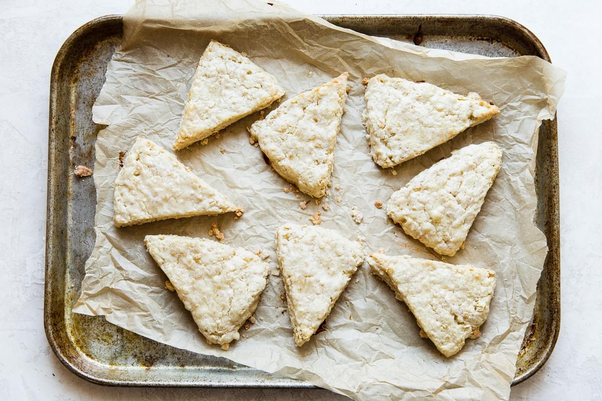 oat scones on a parchment lined baking sheet