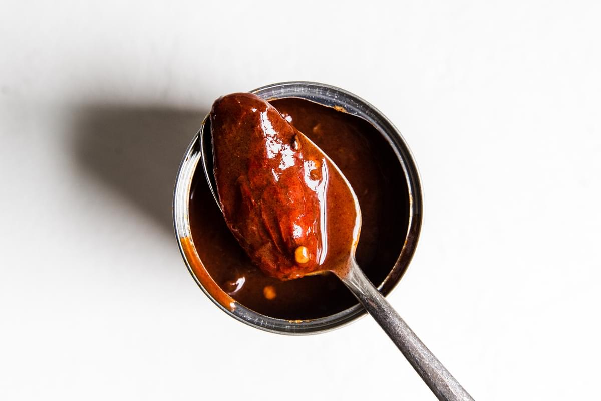 canned chipotle pepper on a spoon