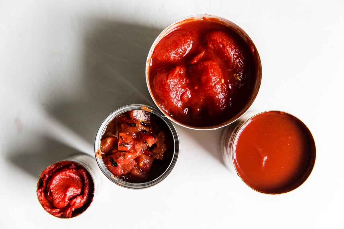 canned tomatoes crushed, canned tomato sauce, can of fire roasted and a can of tomato paste