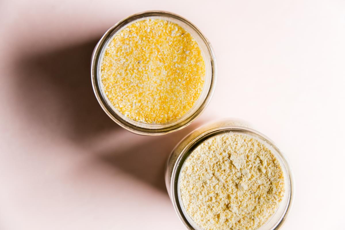 Uncooked polenta and corn meal in jars