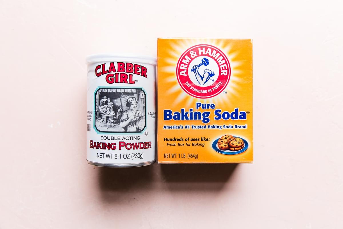A jar of baking powder and a box of baking soda
