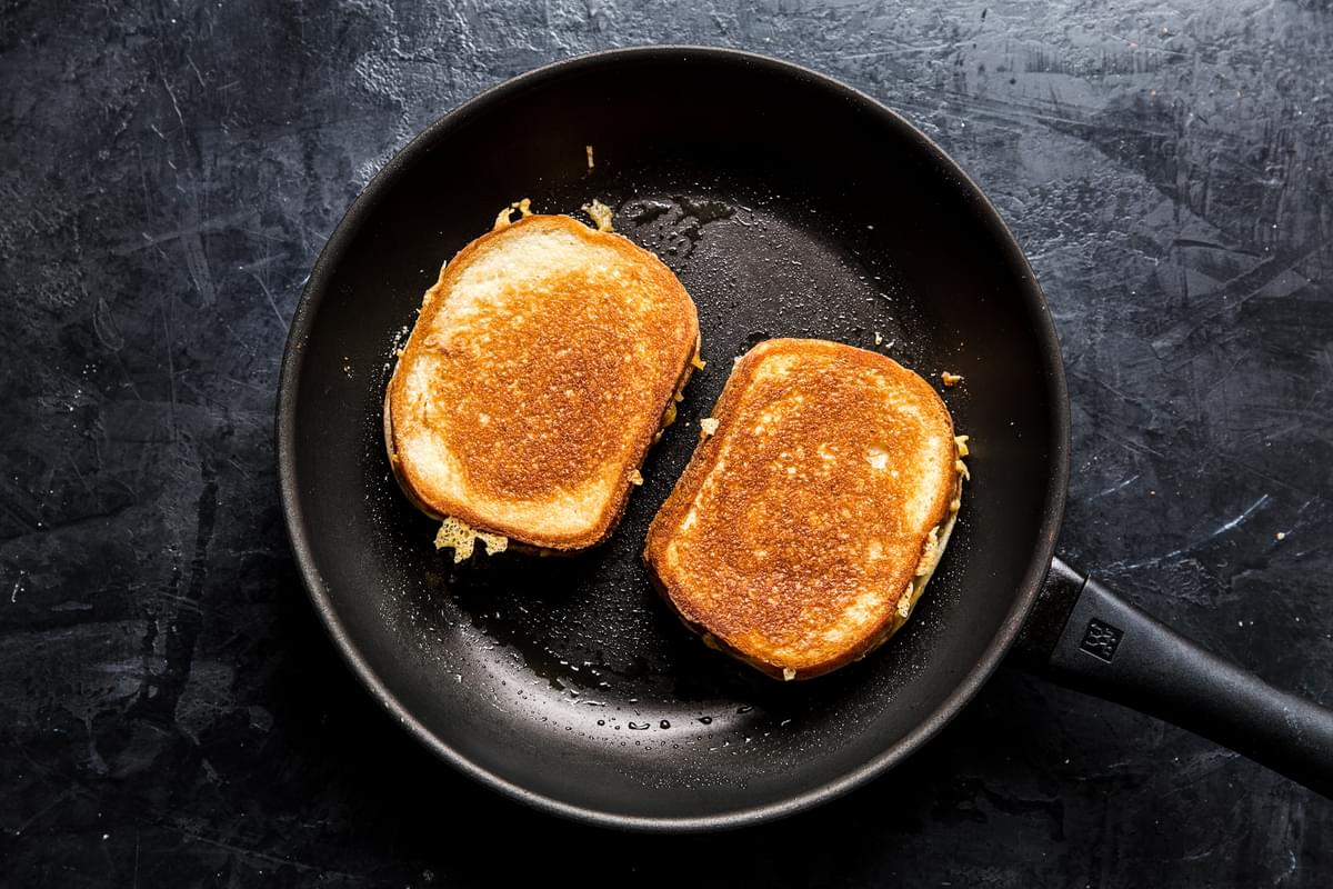 skillet with grilled cheese being cooked