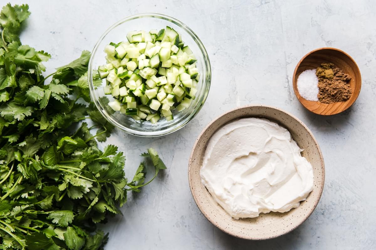 Ingredients for raita in small bowls