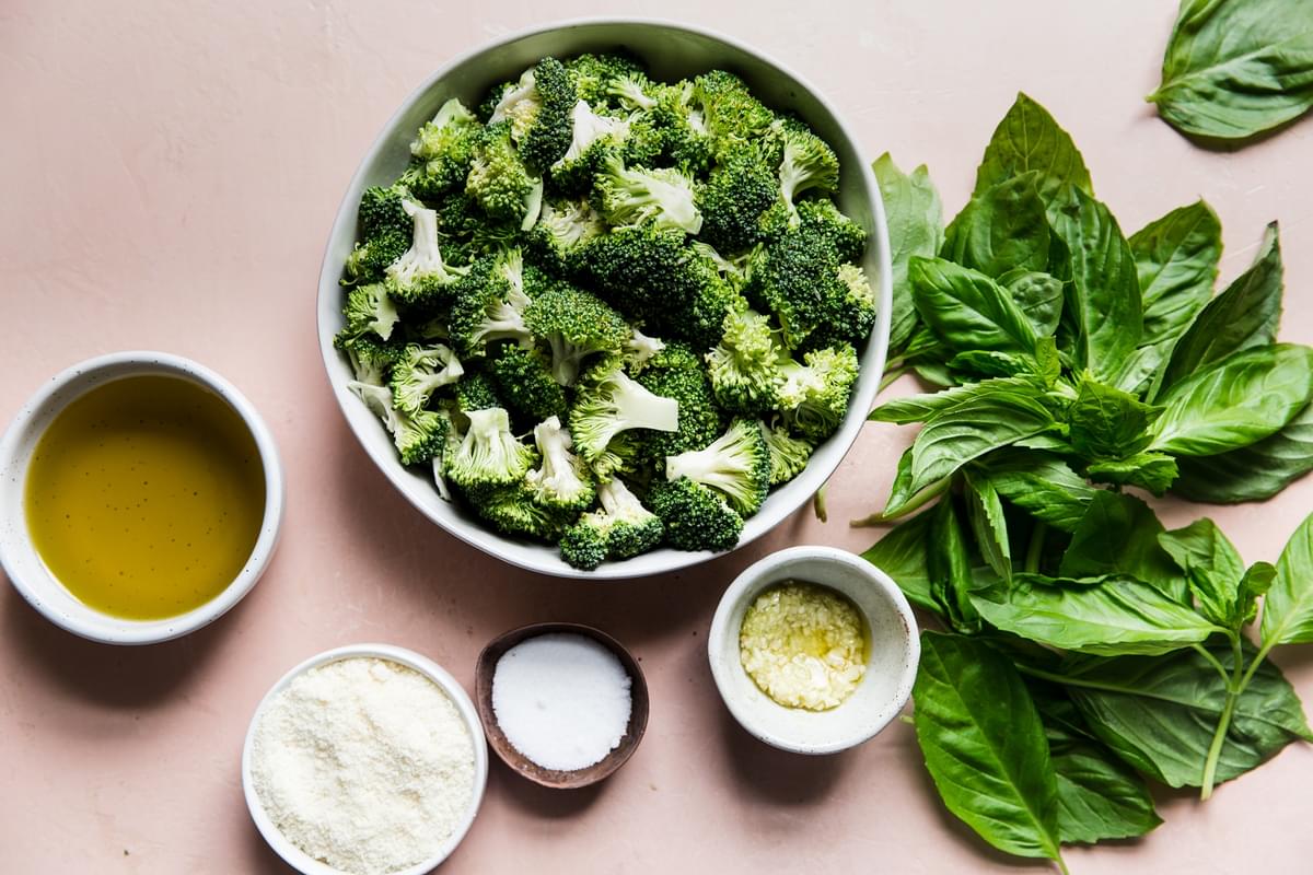 ingredients for broccoli pesto in small bowls
