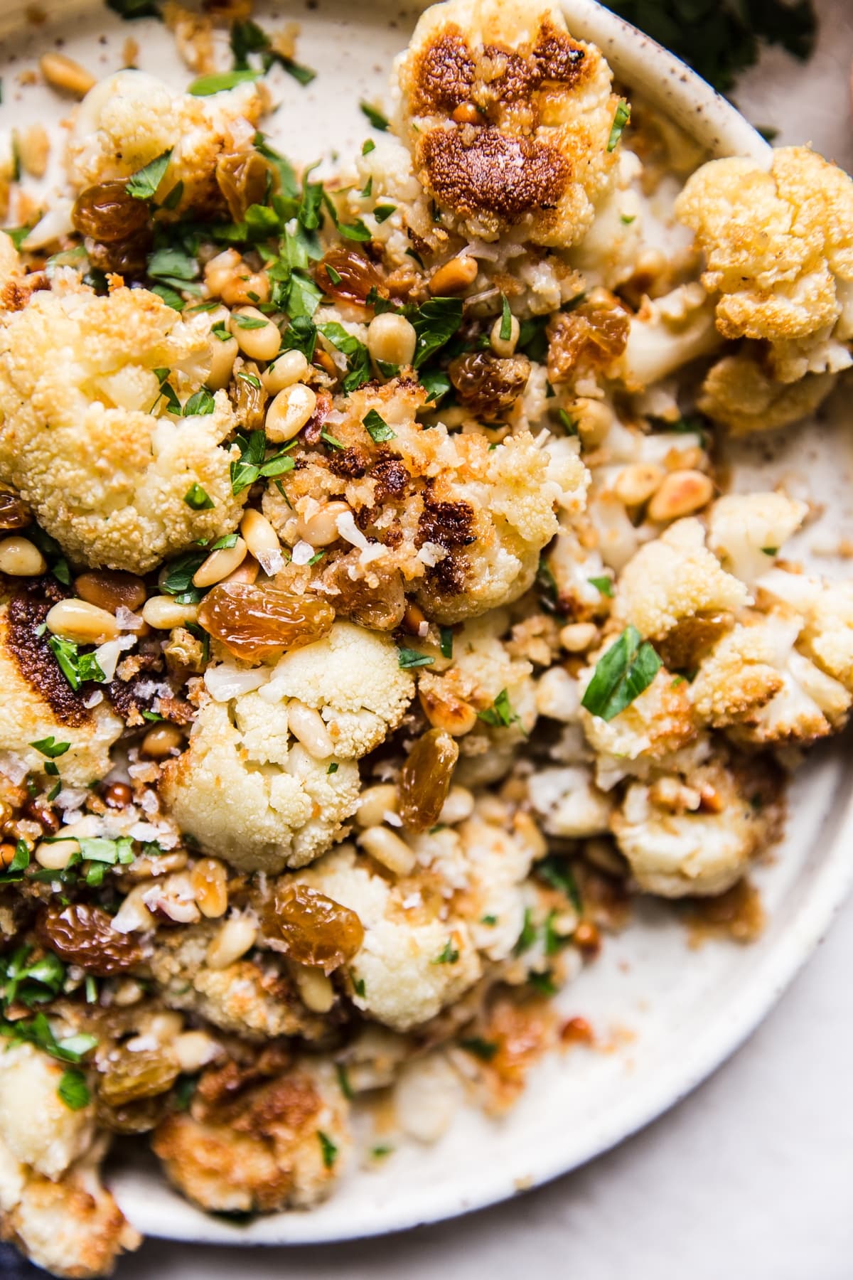 Roasted Cauliflower with Panko and golden raisins on a plate