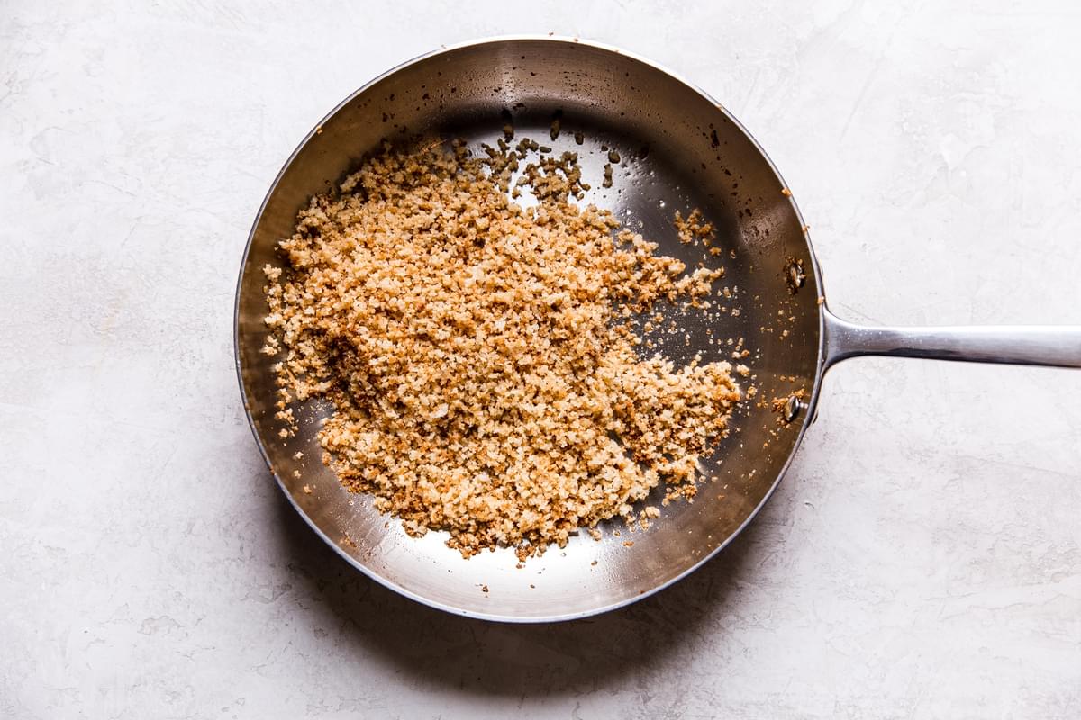 Buttery toasted Panko bread crumbs in a stainless steel skillet