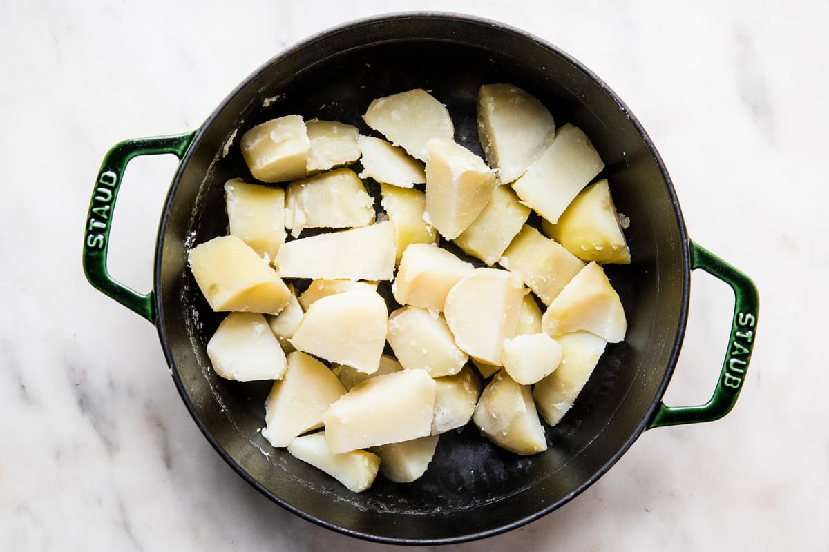 chopped boiled potatoes in a pot
