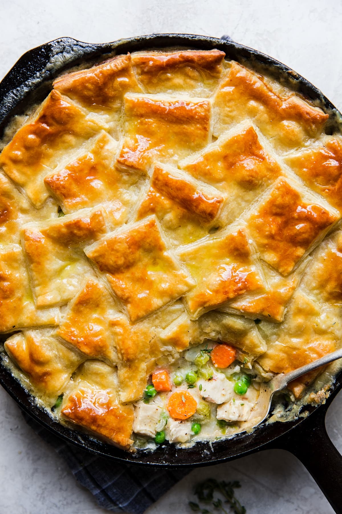 puff pastry chicken pot pie with vegetables made in a skillet