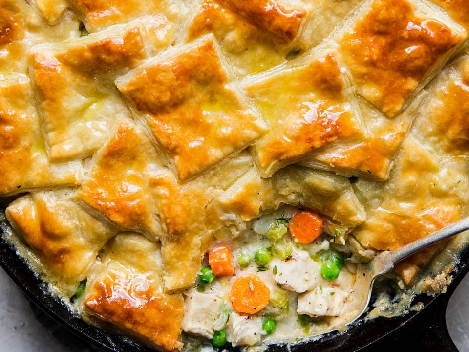 puff pastry chicken pot pie with vegetables made in a skillet