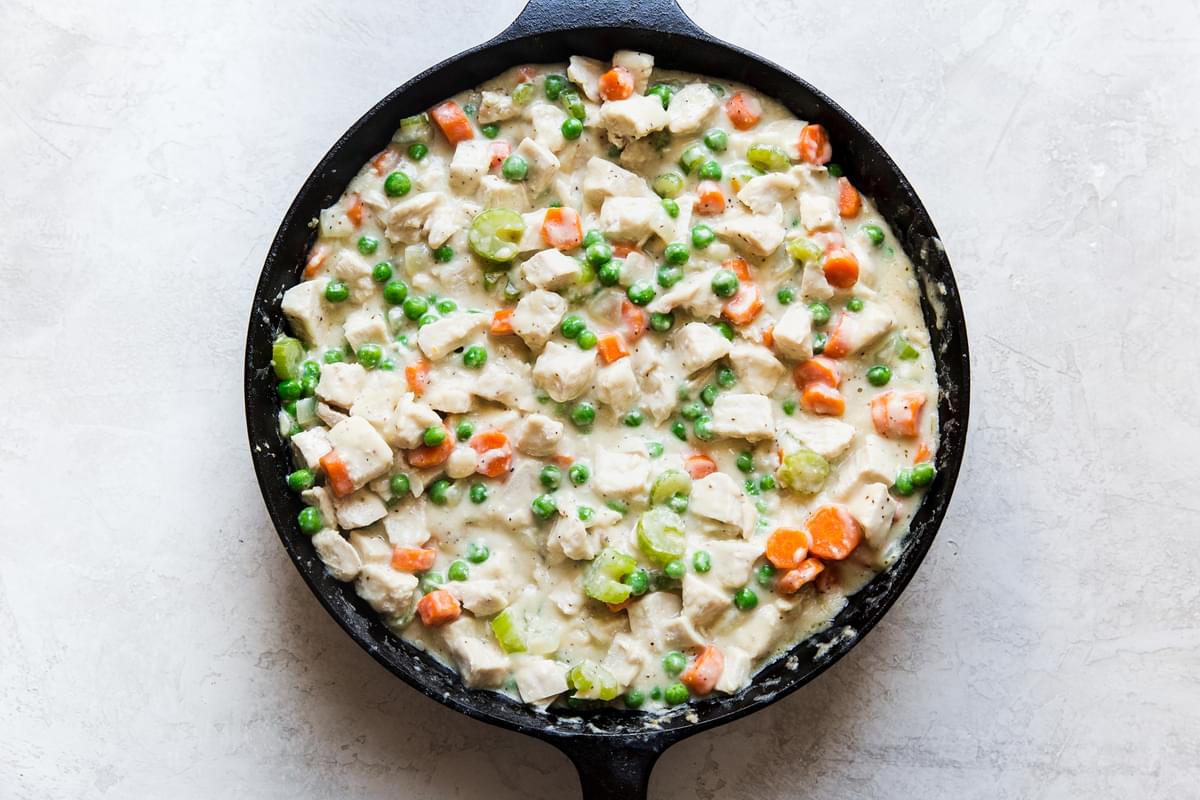 Skillet Chicken Pot Pie filling in a cast iron pan