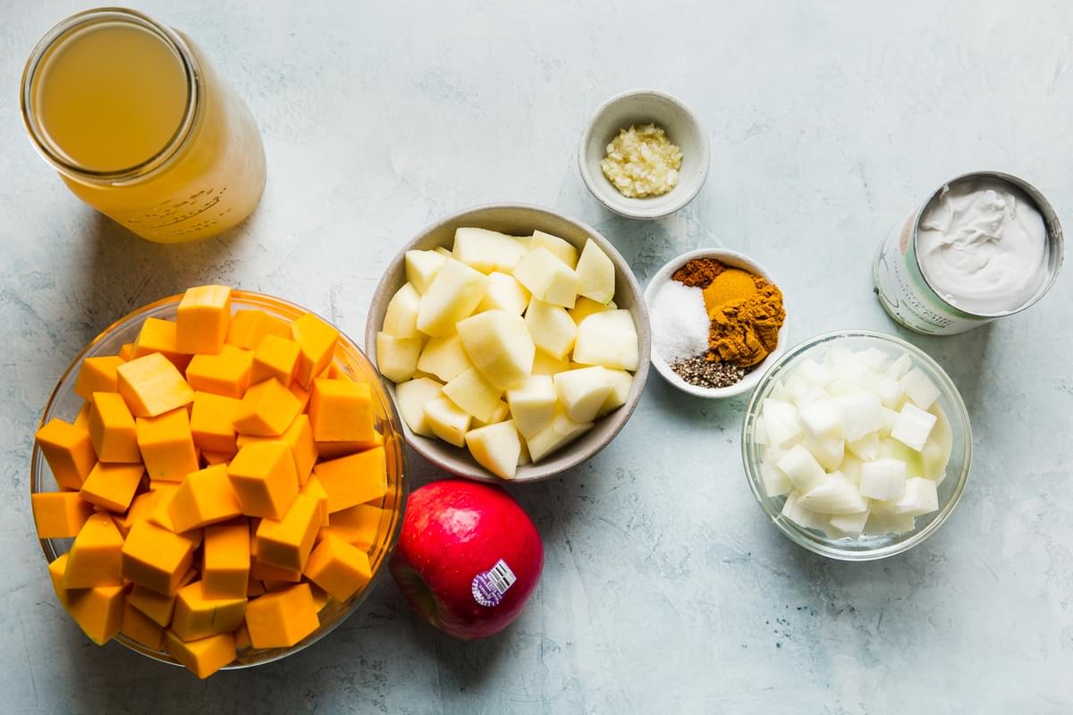 ingredients for slow-cooker butternut squash soup in small bowls
