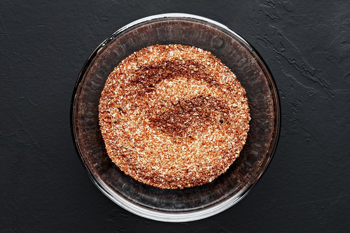 brown sugar, paprika, garlic powder, pepper and salt combined in a glass bowl