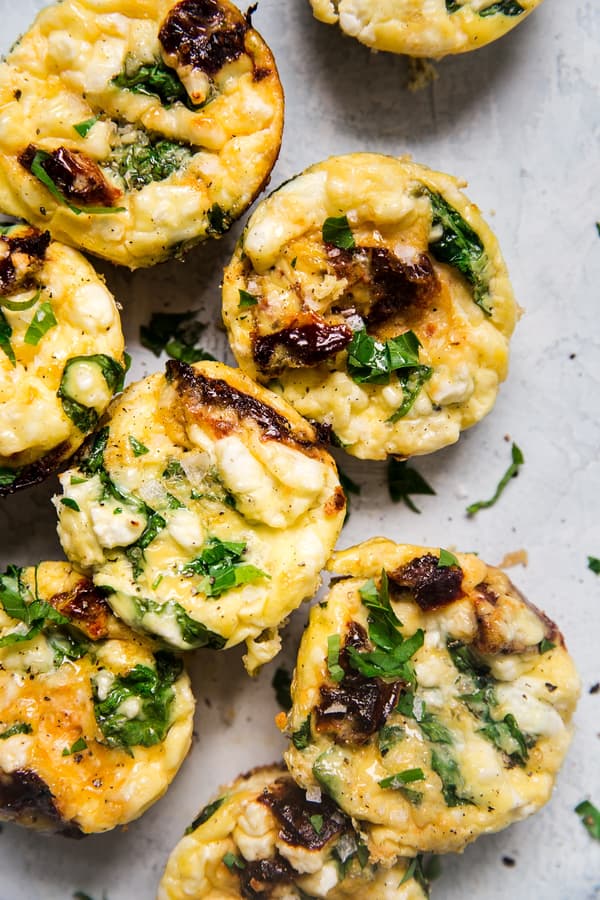 homemade eggs cups made with Feta, Spinach and Sun-Dried Tomatoes